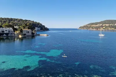 a person in a boat in the water at La Suite de Saint-Jean-Cap-Ferrat, vue mer et accès mer in Saint-Jean-Cap-Ferrat