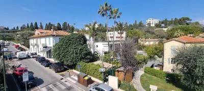an aerial view of a city with cars parked on a street at Bright Appartment perfect location in Saint-Jean-Cap-Ferrat