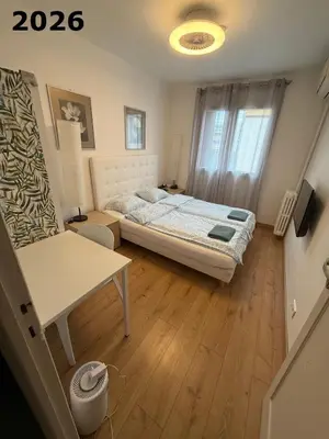 a small bedroom with a bed and a window at The NICE - 3 rooms, 3air cond, 3TV, 3fans, 2 wc, WIfi everywhere 5min aeroport, train, beach, 1min tram, 15 min centre, port, parking possible in Nice