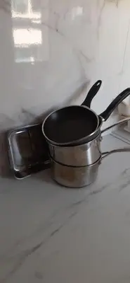 a black pan sitting on top of a stove at Studio cosy à Nice in Nice