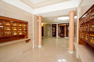a hallway with columns in a building at Promenade des Anglais - Sea View 2bdr in Nice