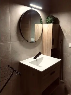 a bathroom with a sink and a mirror at Studio refait neuf Centre-ville in Nice