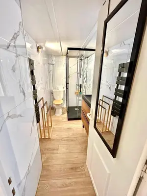 a bathroom with a toilet and a glass door at Petit cocon en duplex - Centre-ville & plage à 2 minutes in Nice