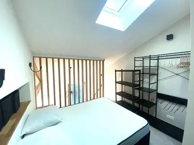 a bedroom with a bed and a window at Lamartine hypercentre 503 in Nice