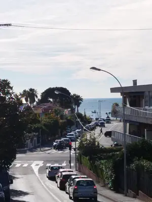 a street with cars parked on the side of the road at Grand 2 pièces à 4mns de la plage in Cagnes-sur-Mer