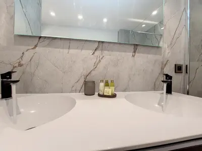 a bathroom with a white sink and a mirror at Nestor&Jeeves - BELLE ETOILE - Central - Premium in Nice