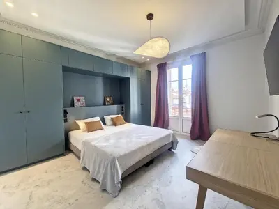 a bedroom with a large bed and a window at Nestor&Jeeves - SEAHORSE - Central - Proche mer in Nice