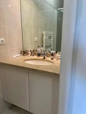 a bathroom counter with a sink and a mirror at Front sea Luxury in Cagnes-sur-Mer