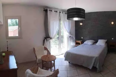 a bedroom with a bed and a large window at Villa avec piscine et vue magnifique sur Nice in Nice