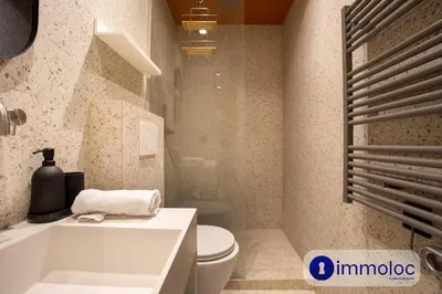 a bathroom with a white toilet and a sink at Air-conditioned apartment in Old Nice in Nice