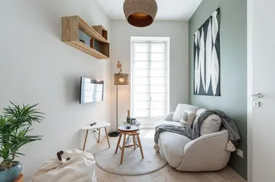 a living room with a couch and a table at Charming Central 1 Bdr in Nice