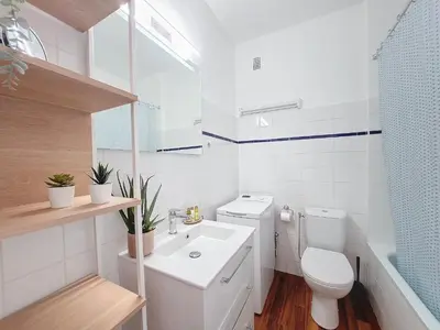 a white bathroom with a toilet and a sink at Nestor&Jeeves - STUDIO RIVIERA - Central - Very close sea in Nice