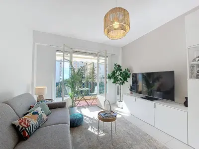 a living room with a couch and a tv at Nestor&Jeeves - STUDIO RIVIERA - Central - Very close sea in Nice