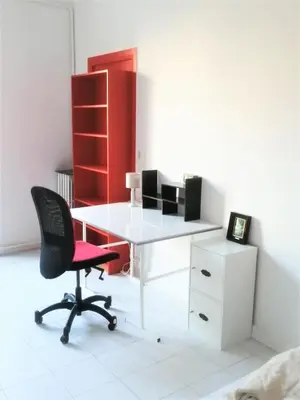 a white desk with a chair and a red cabinet at Appartement 110m2 Nice plein centre in Nice