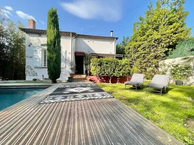 a backyard with a pool and a house at Souvenir à jamais ! in Nice