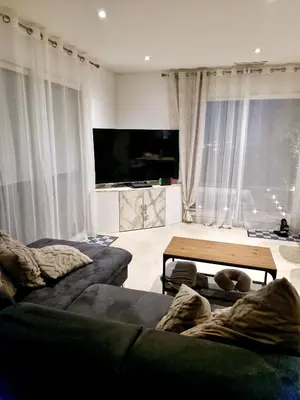 a living room with two couches and a table at Nice, Magnifique villa vue mer avec piscine in Nice