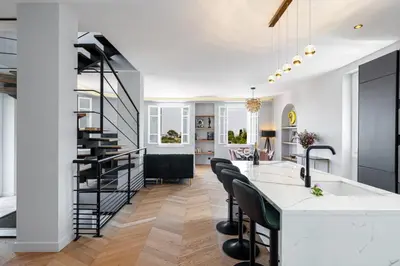 a kitchen and living room with a spiral staircase at MY CASA - HSAUVAN - Villa Design Swimming Pool Sea View in Saint-Jean-Cap-Ferrat