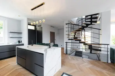 a kitchen with a spiral staircase in a house at MY CASA - HSAUVAN - Villa Design Swimming Pool Sea View in Saint-Jean-Cap-Ferrat