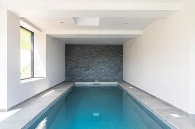 a swimming pool in a house with a window at MY CASA - HSAUVAN - Villa Design Swimming Pool Sea View in Saint-Jean-Cap-Ferrat