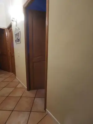 a hallway with a door and a tile floor at Double room with great view in Nice