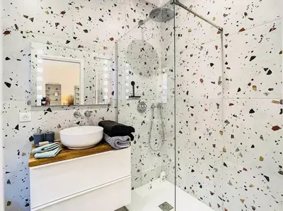 a bathroom with a white sink and a mirror at Appartement Terrasse Proche Port et Plages de Nice in Nice