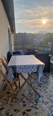 a table and chairs on a balcony with a view at NICE STUDIO 26m2 avec TERRASSE 16m2 in Nice