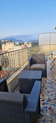 a group of benches sitting on top of a balcony at NICE STUDIO 26m2 avec TERRASSE 16m2 in Nice