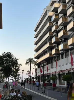 a tall building with people standing in front of it at Carré d'or Studio 2 in Nice