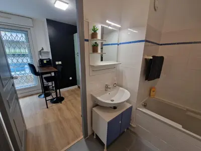 a bathroom with a sink and a toilet and a tub at Aya's Studio in Nice