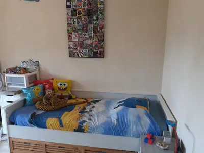 a bedroom with a bed with a stuffed animal on it at VILLA DE CHARME sur la Côte d'Azur in Tourrette-Levens