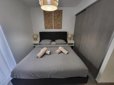 a living room with a mirror and a table at Prestige View 103 By Avecoeur in Èze