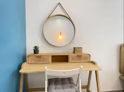 a dressing table with a mirror on a wall at Spacieux Loft Cœur Vieux Nice in Nice