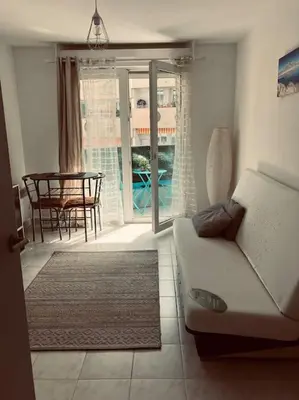 a living room with a couch and a table at Studio Nice proche plages / université in Nice