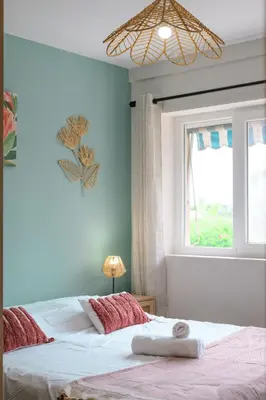a bedroom with a bed with a towel on it at Cosy Morning - L'Azur - Plage 100mètres in Cagnes-sur-Mer