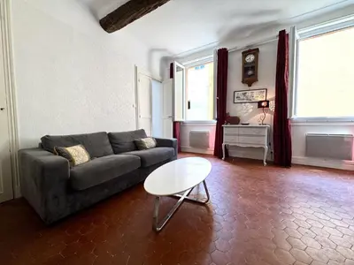 a living room with a couch and a table at ApartHotel Riviera - BARILLERIE 4 - 3 pieces - Old Town Promenade Anglais in Nice