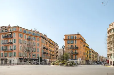 a street with two tall buildings in a city at La Cachette du Port! -Avec parking au Port de Nice in Nice