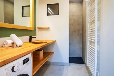 a bathroom with a sink and a washing machine at Villa Reve d azur vi4353 by Riviera Holiday Homes in Nice