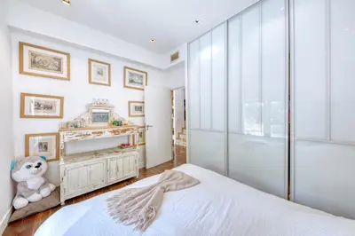 a bedroom with a white bed and a window at Peaceful Haven, Terrace in Nice in Nice