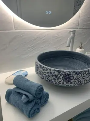 a sink and two towels on a counter in a bathroom at Nouveau - Nice Mamac - centre in Nice