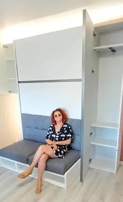 a woman sitting on a bench in a closet at Rose Garden in Cagnes-sur-Mer