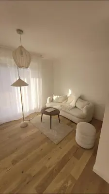 a white living room with a couch and a table at Magnifique appartement Bas Gairaut aperçu mer in Nice