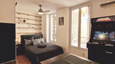a living room with agamuitousuitousuitousuitousuitousuitousuitousuitousuitousuitous at Loft Place Massena in Nice