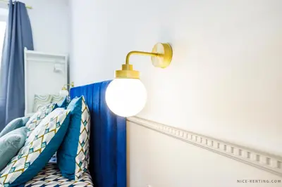 a bedroom with a lamp on the wall at Nice Renting - FRANCE - Luxury Suite Palace Love Jacuzzi - Few meters from Sea in Nice