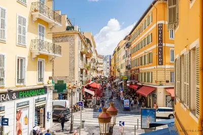 a city street with buildings and people walking on the street at Nice Renting - FRANCE - Luxury Suite Palace Love Jacuzzi - Few meters from Sea in Nice
