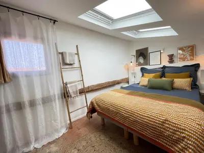 a bedroom with a bed and a window at Nice Renting - NEUVE - Luxury Triplex Old Town Massena Garibaldi - 4 BedRoom - AC in Nice