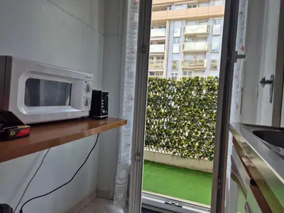 a microwave sitting on a counter next to a window at Le Grand Sud in Nice