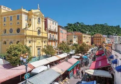 a city street with a bunch of shops and buildings at Studio cosy in Nice