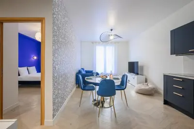 a bathroom with a white vanity and a mirror at Le Walesa, magnifique 3P, spacieux et rénové, Port de Nice in Nice