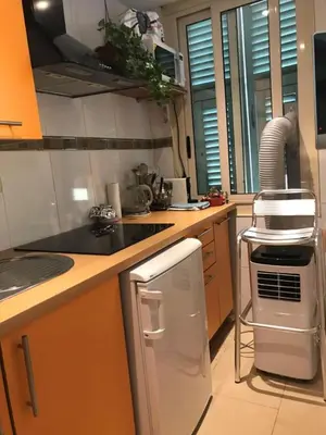 a kitchen with a sink and a stove top oven at Summer Beach Studio, 4 persons, mobile AC, Old Town in Nice