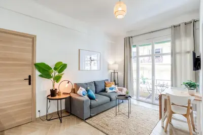 a living room with a couch and a table at #10 2Pièces Fricéro 3min to the beach/Balcon & AC in Nice